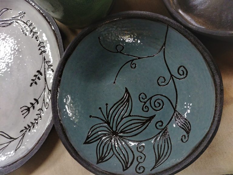 Ceramics, slip carving/scratching, floral design
