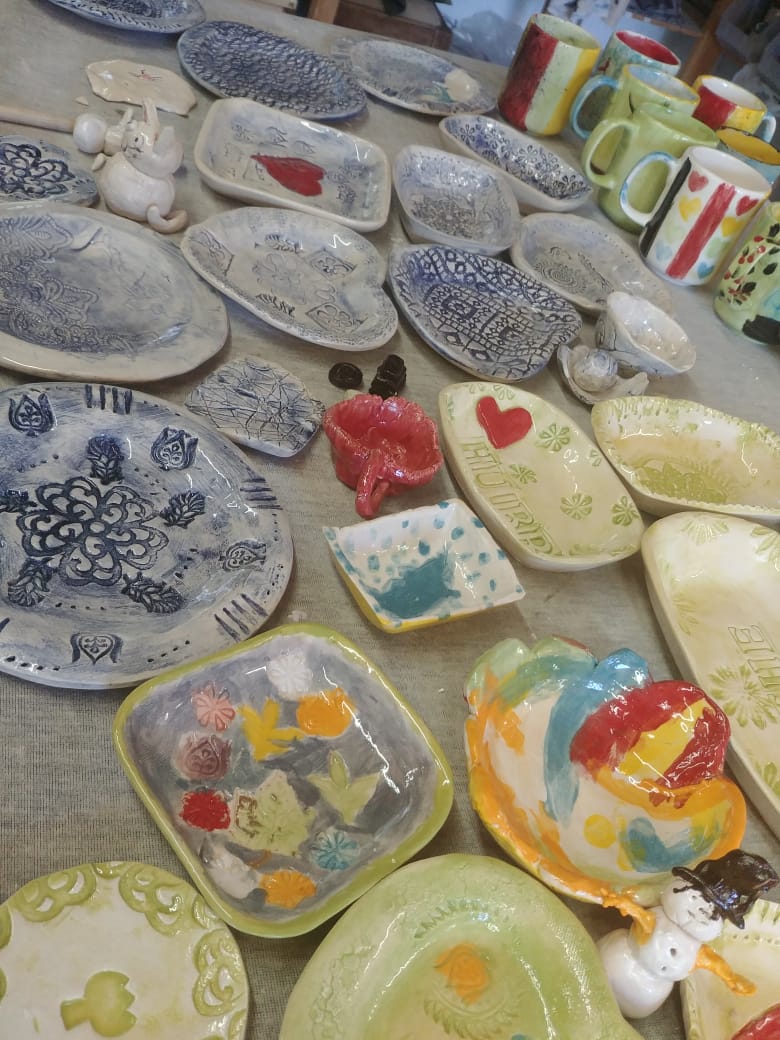 Kids party painted pottery pieces drying